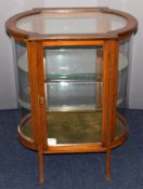 Late 19th or early 20th century inlaid glazed display or bijouterie cabinet with curved end