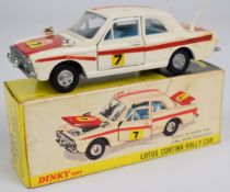 Dinky Toys diecast model Lotus Cortina Rally Car with white/red body, blue interior, silver hubs and