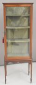 Late 19th or early 20th century glazed display or bijouterie cabinet, with three shelves, raised