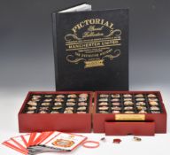Danbury Mint Manchester United Football Club cased pin badge collection and MUFC pictorial history