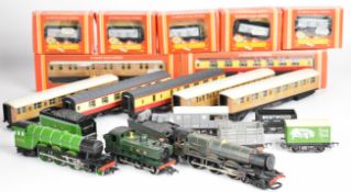 Three Hornby 00 gauge model railway locomotives comprising LNER Flying Scotsman, GWR 8773 and King