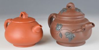 Two Chinese Yixing pottery teapots, each with four character seal mark to base, largest 10cm tall.