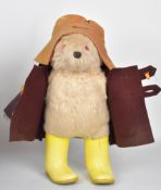 Paddington Bear Teddy with orange felt hat, brown coat and yellow Dunlop Wellington boots together