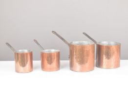 Set four copper saucepans, height of tallest 29.5cm
