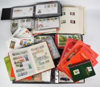 A large GB and Jersey stamp collection comprising ten folders of first day covers, Jersey mint stamp