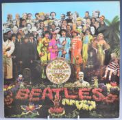 The Beatles - Sgt Pepper's Lonely Heart's Club Band (PCS7027), record appears VG with Factory Sample