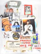 A collection of music related books, ephemera and merchandise, many items signed but