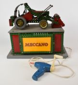 Meccano motorised shop display digger or low loader tractor, raised on illuminated base, 38 x 25.5 x