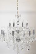 Murano style glass chandelier having two tiers of bulb holders with 12 on the lower and 6 on the