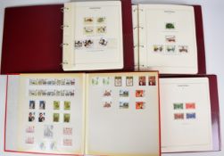 Four albums of mostly mint GB stamps including gutter pairs