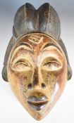 19th / 20thC African carved tribal mask, Punu tribe, Gabon, 35cm tall.