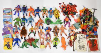 A collection of He-Man Masters of the Universe figures to include Roboto, Man at Arms, Two-Bad,