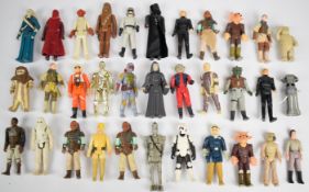 Thirty-three vintage Star Wars figures to include Luke Skywalker, Darth Vader, Chewbacca, Nien Nunb,
