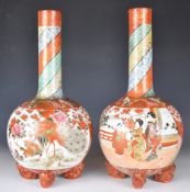 Japanese Satsuma pair of bottle vases, each raised on four animal feet and decorated with figures,