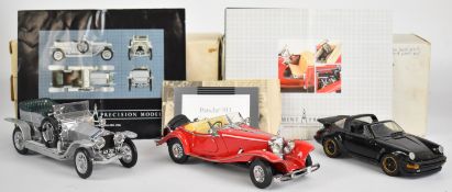 Three Franklin Mint diecast model cars comprising 1906 Rolls Royce Silver Ghost, 1935 Mercedes 500 K