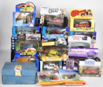 Twenty four TV and film related diecast model cars to include The Blues Brothers, Charlies Angels,