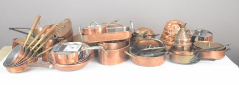 Approximately fifty pieces of copper and similar kitchen ware including jelly moulds, frying pans,