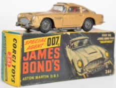 Corgi Toys diecast model James Bond Aston Martin DB5 with gold body, red interior, opening roof,