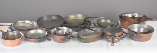 Approximately thirty frying and similar shallow copper pans, length of largest 51cm