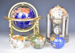 Five pietra dura globes comprising two on stands, one with clock, thermometer and hygrometer and