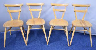 Set of four Ercol light elm stacking retro chairs, with green painted circles to backs