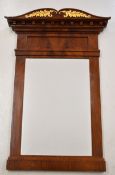 19th century Empire style mirror, the flame mahogany frame having gilt leaf decoration to top,