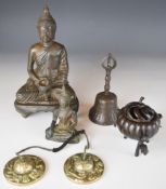 Five eastern bronzes and similar including bronze figures of the young Buddha, pair of roundels