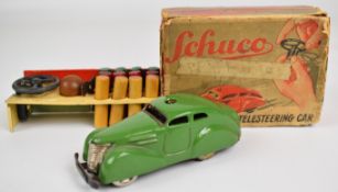 Schuco clockwork tinplate Telesteering Car 3000 with green body, in original box with steering