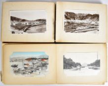 Two Japanese lacquer postcard albums including Chinese coolies Singapore, Boat Quay, Hong Kong