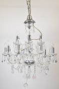Murano style glass chandelier having two tiers of bulb holders with 12 on the lower and 6 on the