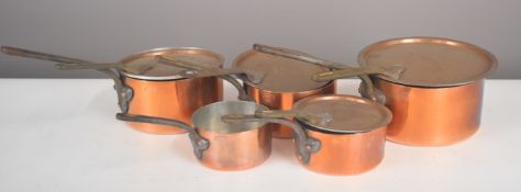 Five Allez Freres French copper saucepans, some with lids, length of largest 41cm