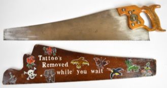 Novelty vintage woodworking saw with hand decorated cover 'Tattoos Removed while you wait', length