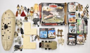 A collection of vintage Kenner Star Wars figures and vehicles to include Speeder Bike, MLC-3, INT-4,