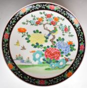 Chinese famille noir charger decorated with birds and flowers, 45.5cm in diameter.