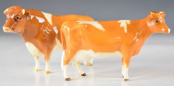 Beswick Guernsey bull and cow figures, tallest 12cm