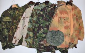 Seven military and similar camouflage jackets with various markings and labels including NATO, Czech