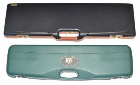 Two shotgun hard carry cases comprising Negrini and John McNab