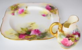 Royal Worcester cake plate, diameter 21cm and a flatback jug decorated with roses, height 11cm