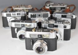 Eight 35mm film cameras comprising Voigtlander Vitomatic II, two Vito CLR, Yashica EE, Kodak