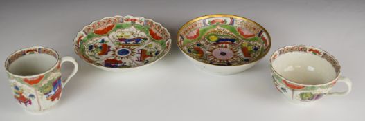 First period Worcester cup, coffee can and two saucers decorated with dragons in compartments,