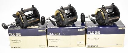 Three Shimano TLD 25 multiplier fishing reels, all boxed with paperwork / accessories, all appear
