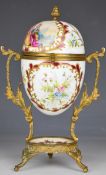 Dresden style egg casket and underplate decorated with Watteau scene and raised on ormolu style