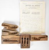 Five walnut shotgun or rifle lock and forend catch casting moulds together with nine gun related