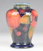 Early Moorcroft squat baluster vase decorated in the Pomegranate, height 9cm