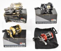 Four Abu Ambassadeur multiplier fishing reels comprising 6500C3 CT Mag Hi-Speed, 6600DS, 6500C3