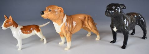 Two Beswick Staffordshire bull terriers and an English bull terrier includes Bandits Brintiga,