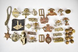 A collection of approximately twenty British Army metal badges including 16th Lancers, 17th/21st