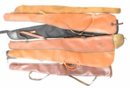 Seven various shotgun or rifle gun slips including leather and Brady style examples.