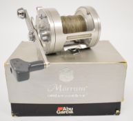 Abu Ambassadeur Morrum M7700CT multiplier fishing reel, boxed with soft pouch, paperwork and