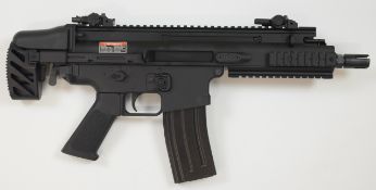 Cybergun FN Herstal Scar 6mm assault style airsoft rifle with tactical stock, textured pistol